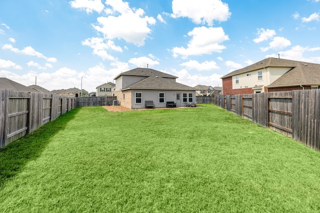 rear view of house with a yard