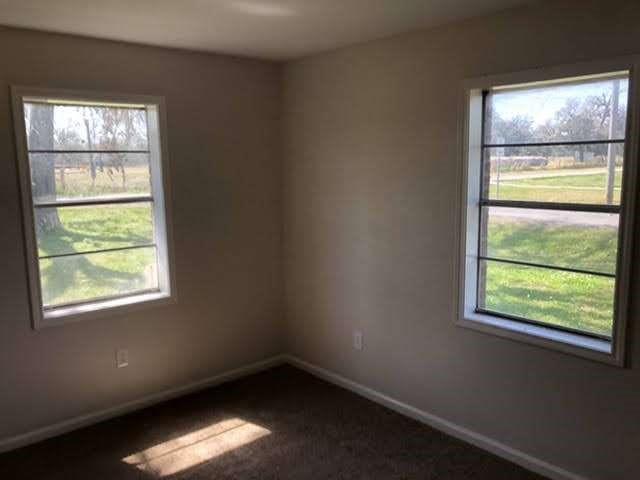 spare room with plenty of natural light