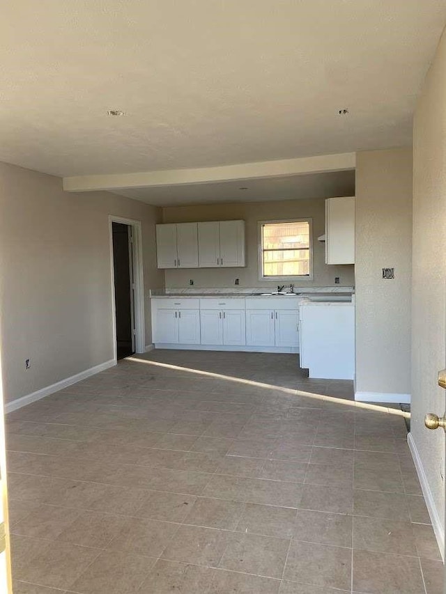 kitchen with white cabinets and sink