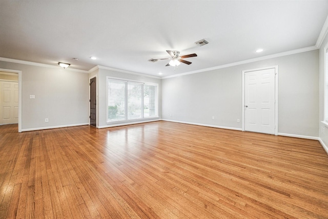 spare room featuring crown molding, ceiling fan, and light hardwood / wood-style floors