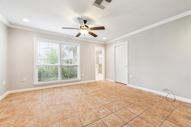 tiled spare room featuring ceiling fan and ornamental molding