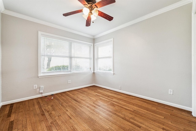 spare room with crown molding, hardwood / wood-style floors, and a healthy amount of sunlight