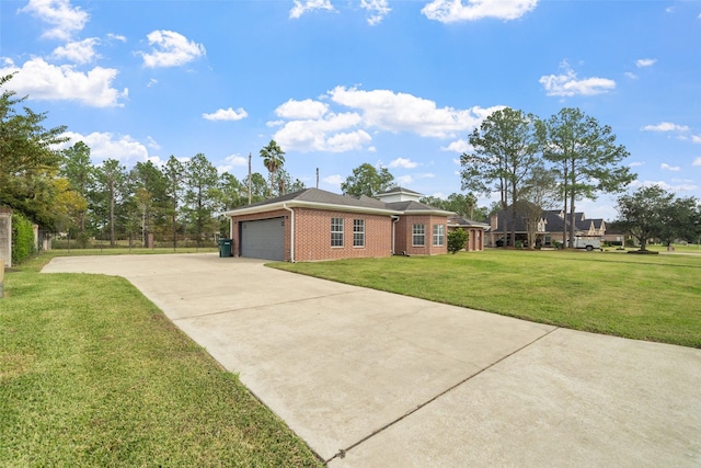 ranch-style home featuring a garage and a front lawn