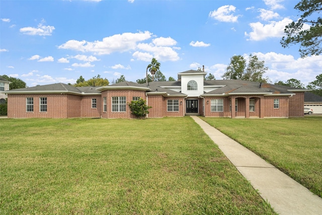 ranch-style home with a front lawn