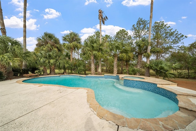 view of swimming pool with an in ground hot tub and a patio