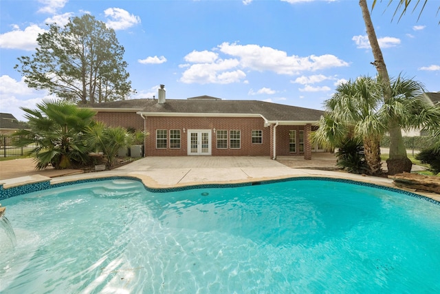 view of pool featuring french doors and a patio