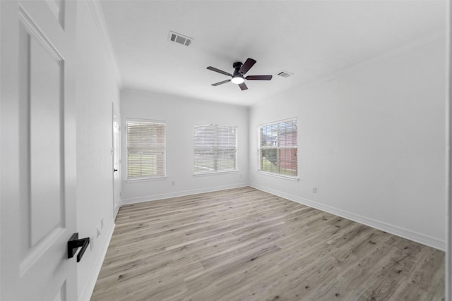 unfurnished room with light hardwood / wood-style flooring, ceiling fan, and crown molding