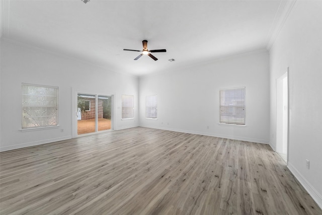 unfurnished living room featuring light wood-type flooring, ceiling fan, and ornamental molding