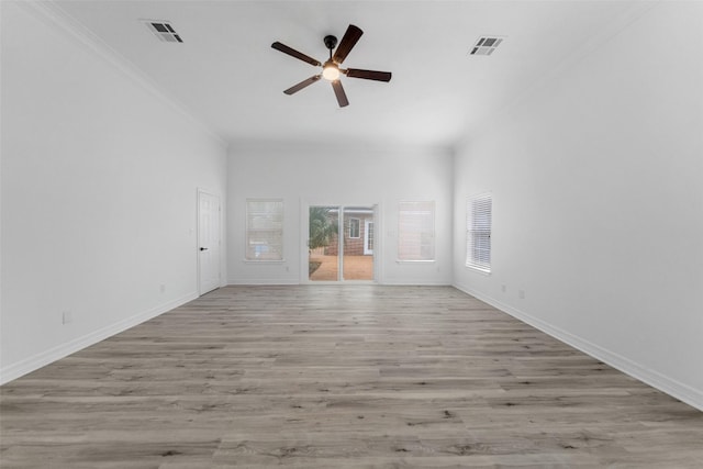 unfurnished living room featuring ceiling fan, light wood-type flooring, and crown molding