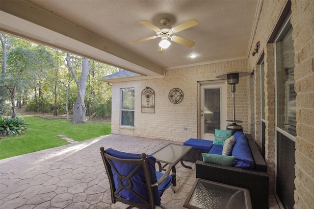 view of patio / terrace featuring ceiling fan and an outdoor living space