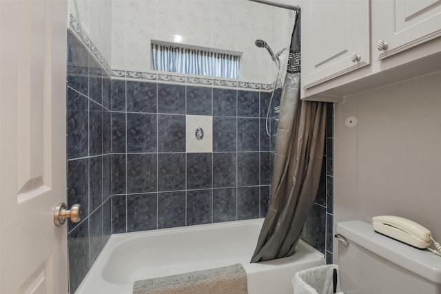 bathroom with toilet and shower / tub combo