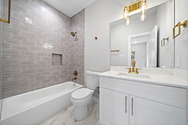 full bathroom featuring tiled shower / bath, vanity, and toilet