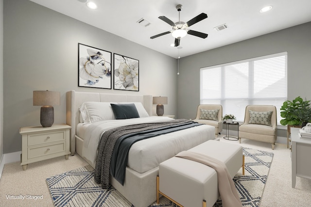 bedroom featuring light carpet and ceiling fan