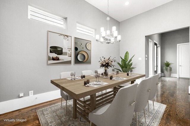 dining area featuring a chandelier and dark wood-type flooring