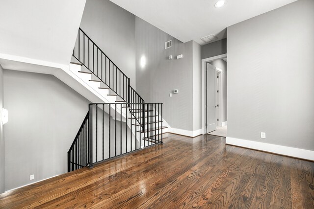 stairs with wood-type flooring