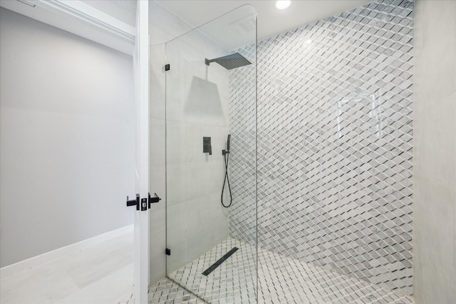 bathroom with tile patterned floors and walk in shower