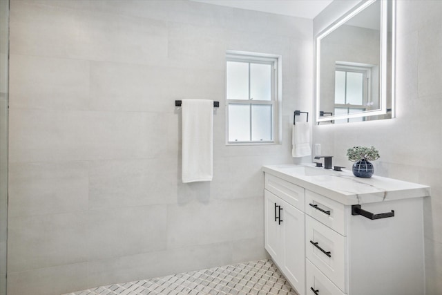 bathroom with tile patterned flooring and vanity