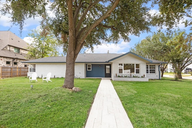 ranch-style home with a front yard