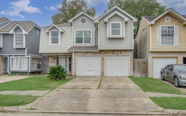 view of front of house featuring a front lawn and a garage