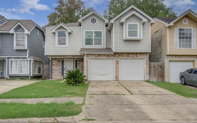 view of front of home with a front lawn and a garage