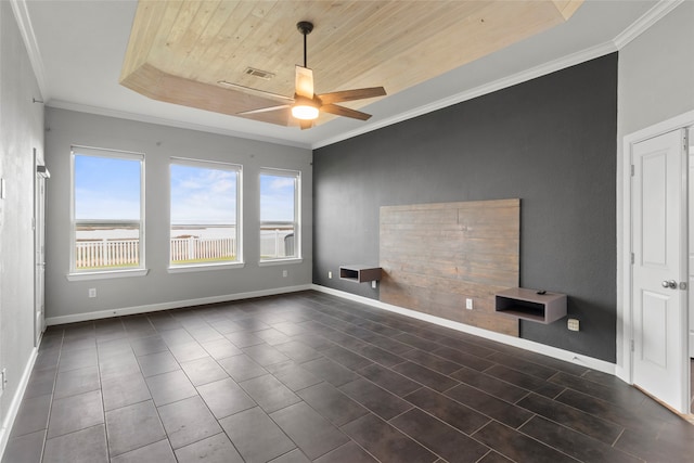 unfurnished room with a tray ceiling, ceiling fan, crown molding, and wooden ceiling