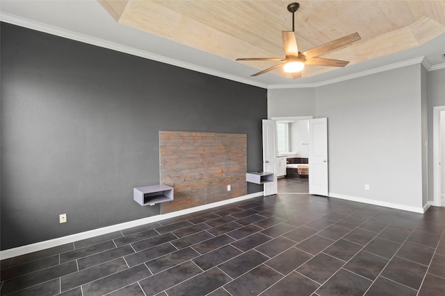 spare room featuring ceiling fan, wood ceiling, ornamental molding, and a tray ceiling