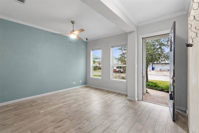 foyer featuring a healthy amount of sunlight, light hardwood / wood-style floors, and crown molding