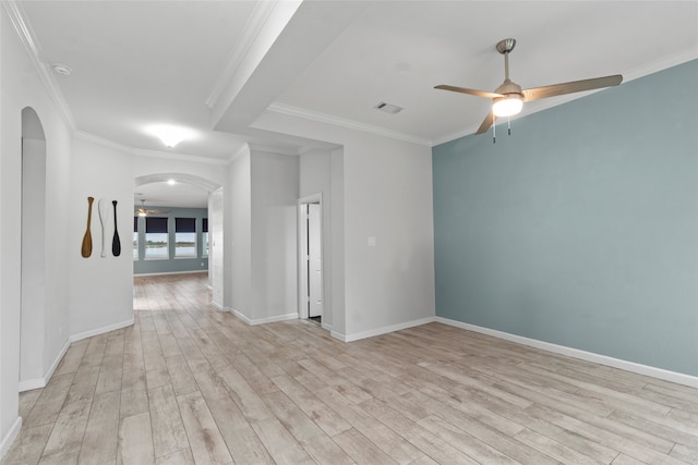 spare room featuring light hardwood / wood-style flooring, ceiling fan, and ornamental molding