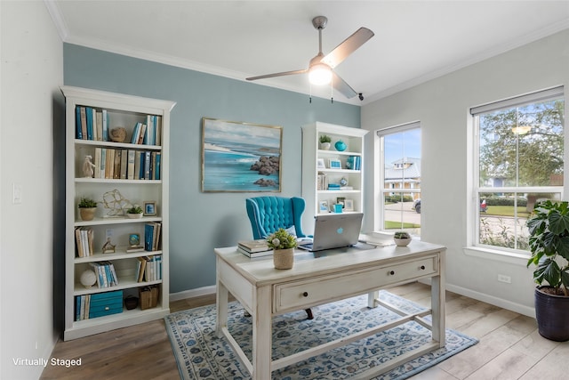 office space featuring light hardwood / wood-style floors, ceiling fan, and ornamental molding