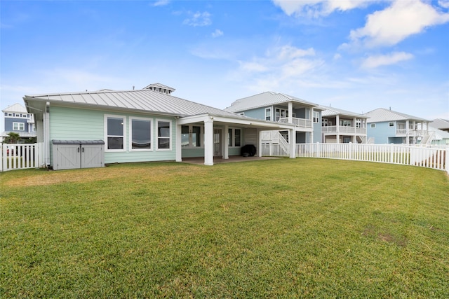 rear view of property with a lawn