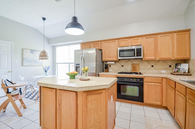 kitchen featuring lofted ceiling, black appliances, light tile patterned floors, decorative light fixtures, and a kitchen island