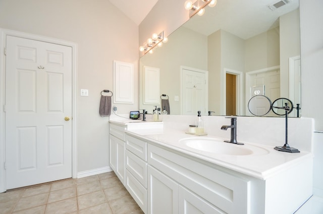 bathroom with vanity, high vaulted ceiling, and tile patterned floors