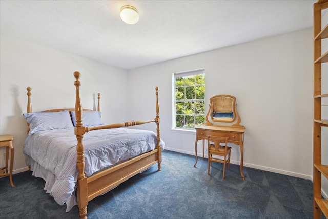 bedroom with carpet floors and baseboards