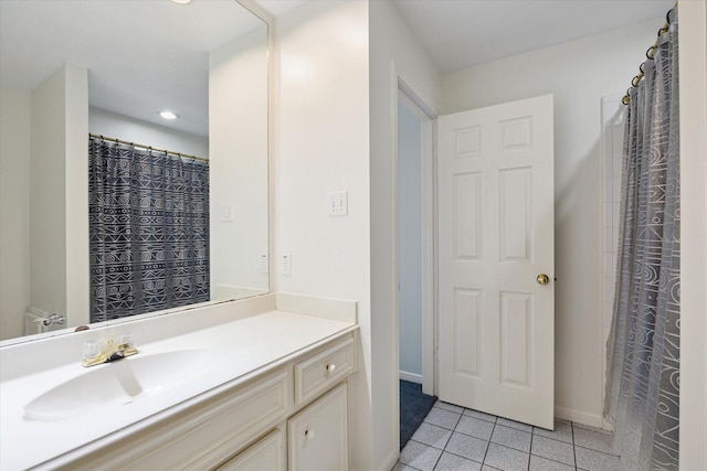 bathroom featuring baseboards, recessed lighting, vanity, and tile patterned floors