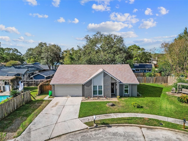 ranch-style house with a front yard and a garage