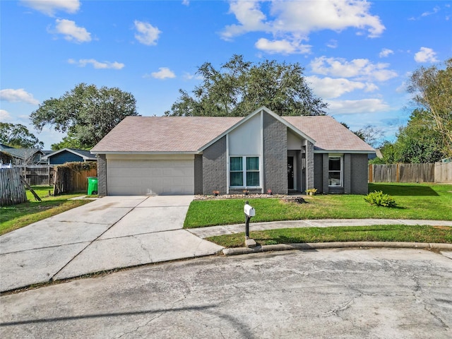 ranch-style home featuring a front lawn and a garage