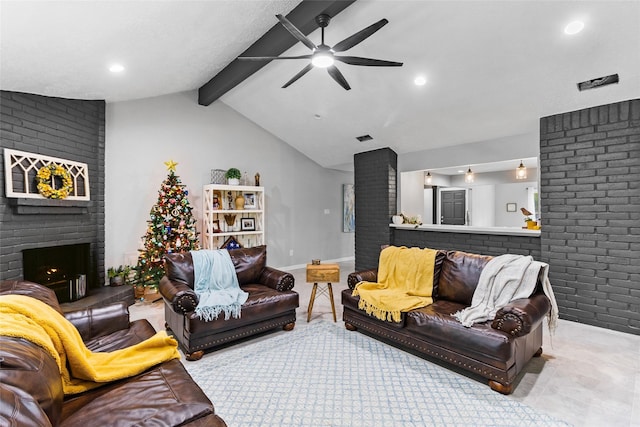 living room with vaulted ceiling with beams, ceiling fan, brick wall, and a brick fireplace