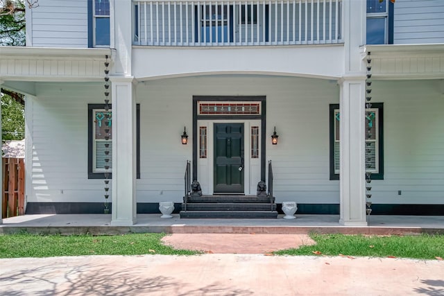 entrance to property with a balcony