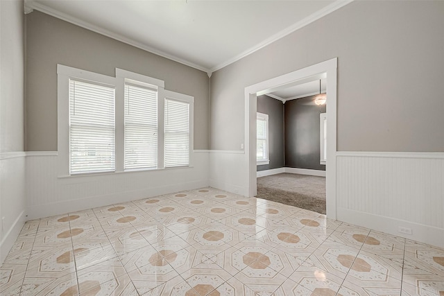 carpeted empty room featuring ornamental molding