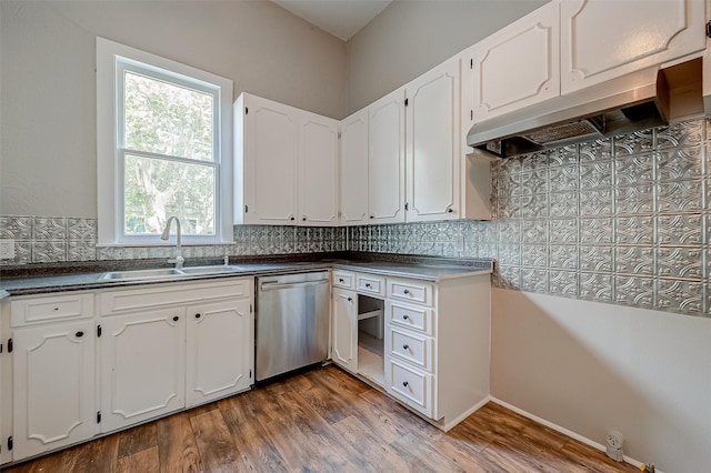 kitchen featuring dishwasher, white cabinetry, and tasteful backsplash