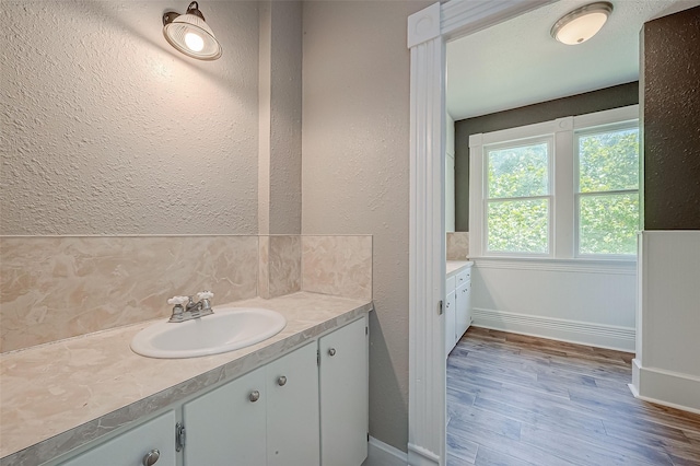 bathroom featuring vanity and wood-type flooring