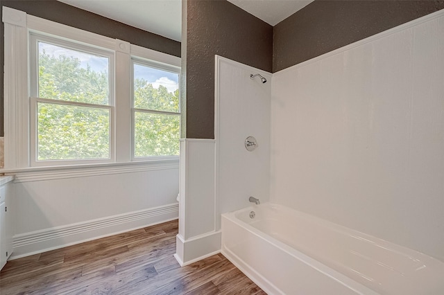 bathroom featuring hardwood / wood-style floors and shower / bath combination