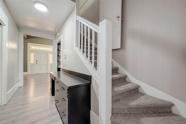 stairway featuring wood-type flooring