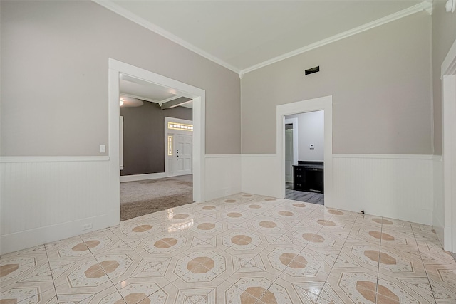 unfurnished bedroom featuring connected bathroom, crown molding, and light colored carpet