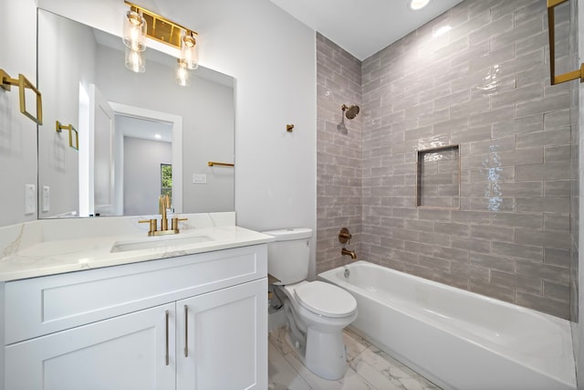 full bathroom with vanity, toilet, and tiled shower / bath combo