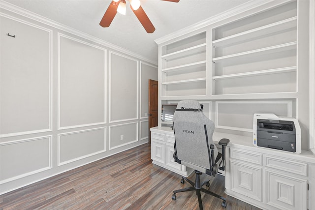 home office featuring dark hardwood / wood-style flooring, ceiling fan, and crown molding