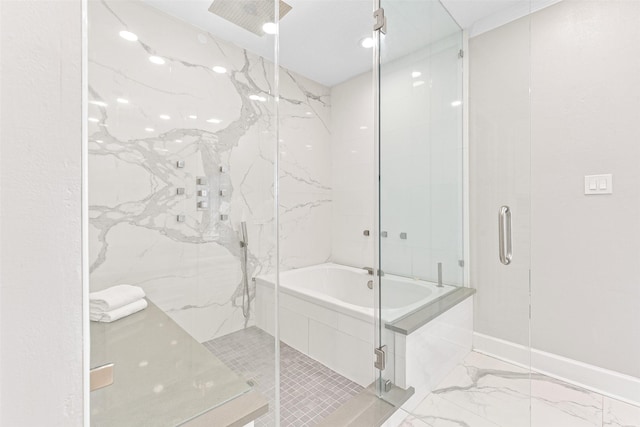 bathroom featuring separate shower and tub