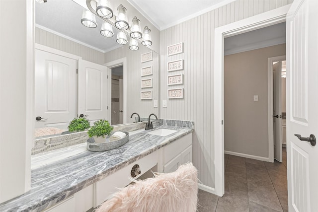 bathroom with tile patterned floors, vanity, and ornamental molding