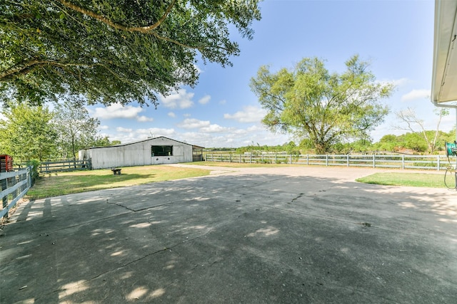 exterior space featuring a rural view and an outdoor structure