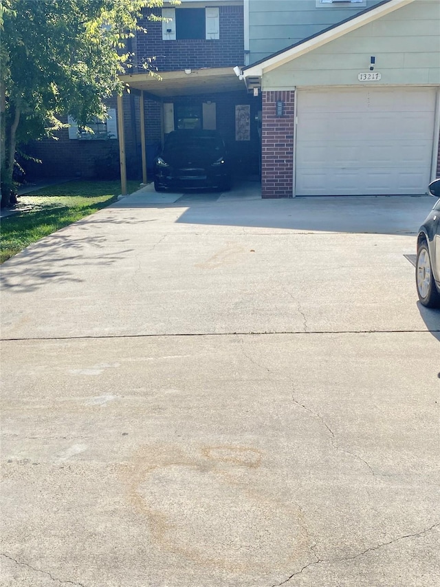 garage featuring a carport